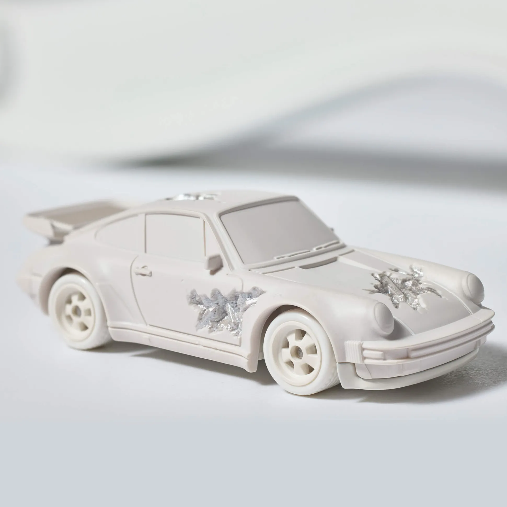 Hot Wheels x Daniel Arsham Eroded Porsche 930 and Rally Case